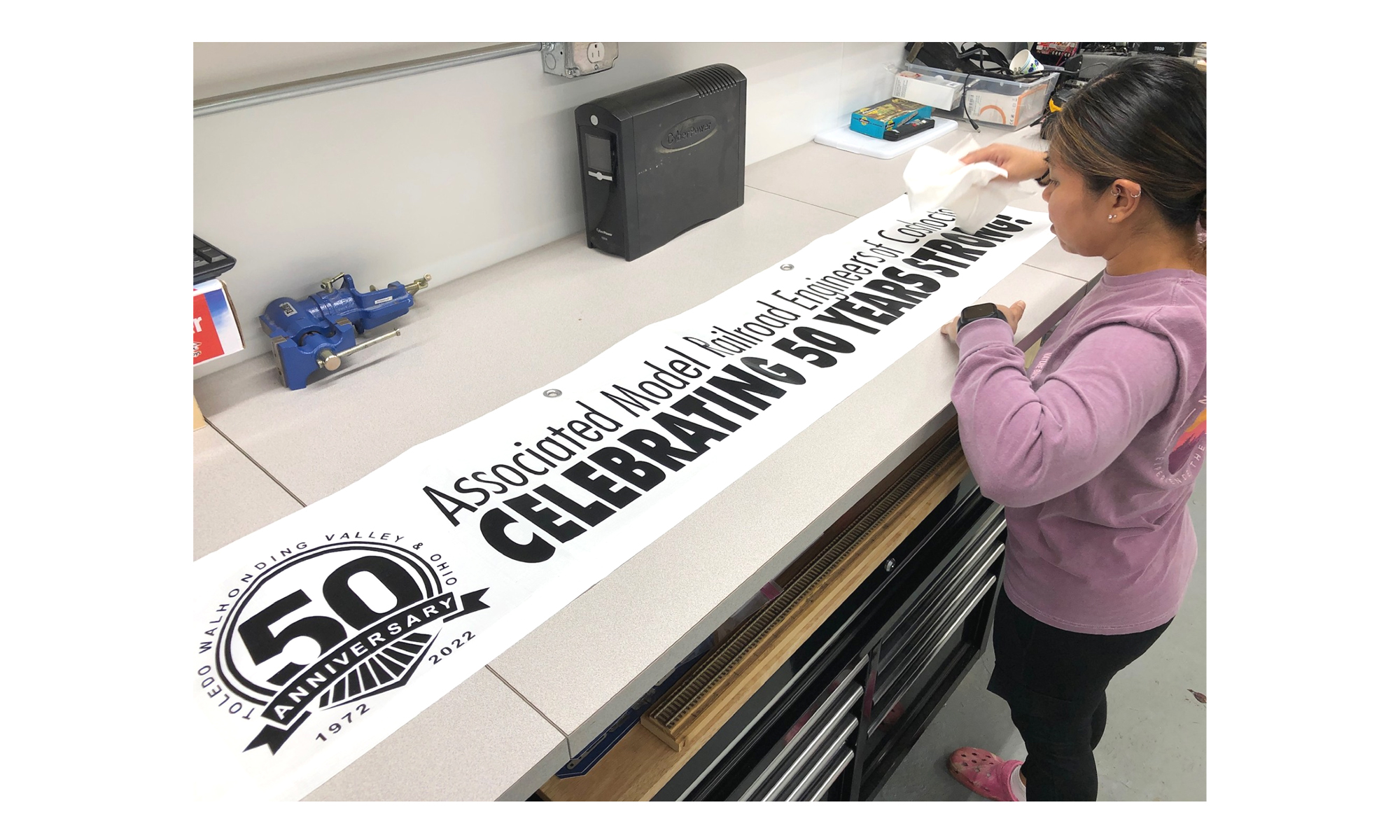 AMREC 50TH MAKING THE BANNER